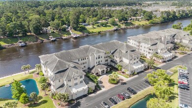 Aerial perspective of suburban area with a large body of water