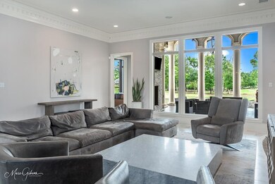 Living room featuring a wall full of windows overl