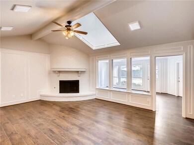 Spacious living room with stunning brick corner fi