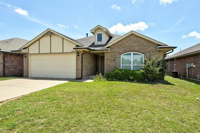 View of front of house featuring a 2 car garage, concrete driveway, and beautiful front yard.