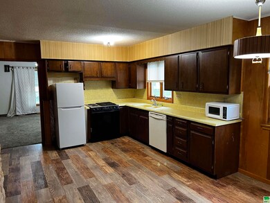 Looking at kitchen from the garage entrance.