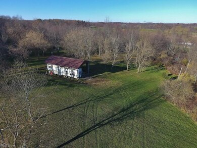 Accessed by a charming trail behind the home is th