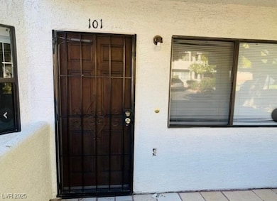 Entrance to property with stucco siding