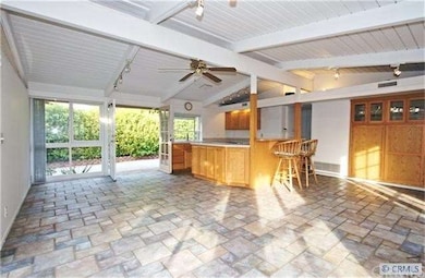View of living room  and kitchen looking north.