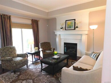 Living Room with custom tiled gas fireplace