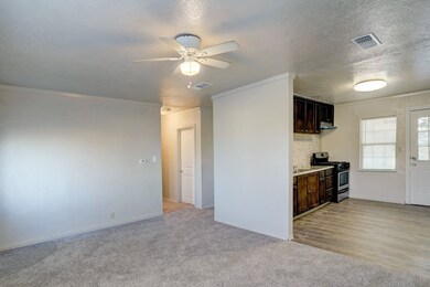 Living room is open to the kitchen.
