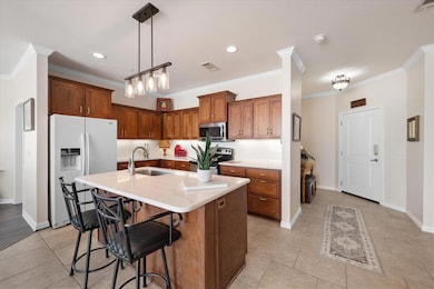 Kitchen featuring sink, light tile patterned floor