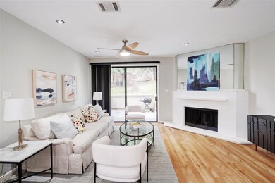 Living room featuring wood finished floors, a cei