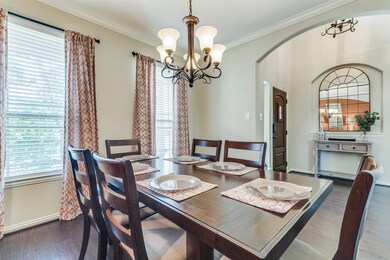 A view of the formal dining looking towards the two story entry.