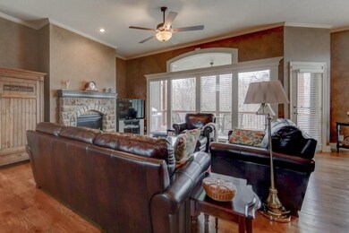 Wall of windows in great room w/beautiful views of
