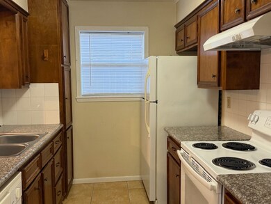 Kitchen featuring white appliances, under cabinet