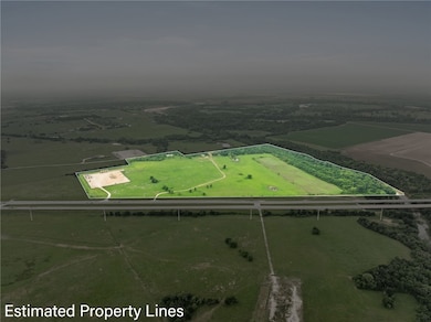Birds eye view of property featuring a rural view