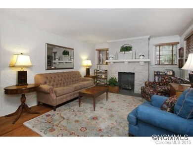 Living room w/ stone fireplace