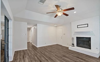 Unfurnished living room with wood finished floors