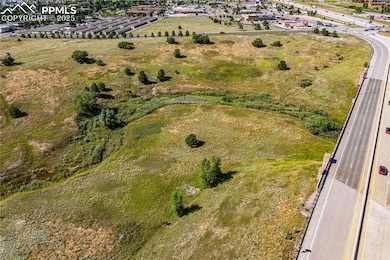 Dirty Woman Creek along the bottom of the photo with both lots rising above it.