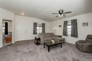Living room with lofted ceiling, healthy amount of