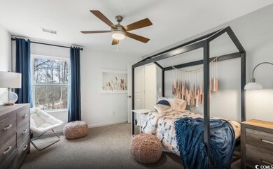 Bedroom with carpet flooring and ceiling fan