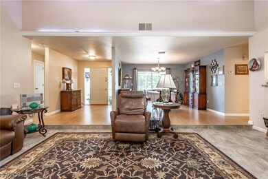 An open entryway, living room, & formal dining are great for entertaining