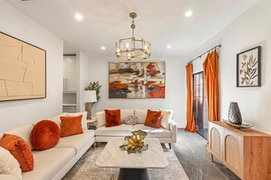 Living room featuring an inviting chandelier