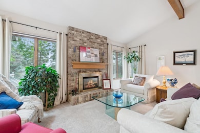 Main floor boasts vaulted ceilings, lots of natural light, and the living room with fireplace!