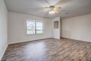 Spare room with ceiling fan, dark hardwood / wood-