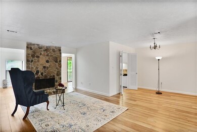View into the living room from the hall. Frontdoor