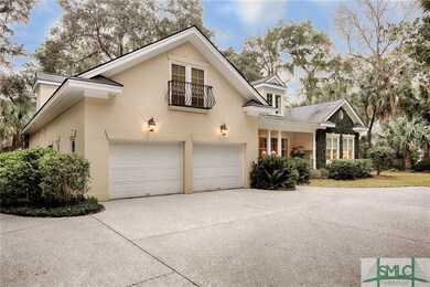 Exterior front with 2 car garage, handmade iron ra