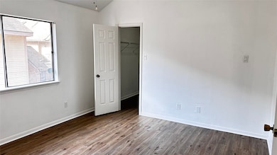 Spacious primary bedroom with convenient access to