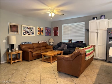 Living area featuring light tile patterned floorin
