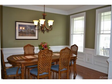 Beautiful formal dining room with wainscoting and 