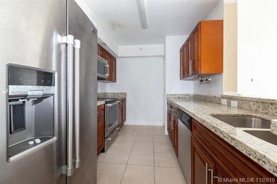 Beautiful kitchen with granite counter top.  Electric range, side-by-side refrig, dishwasher and microwave.