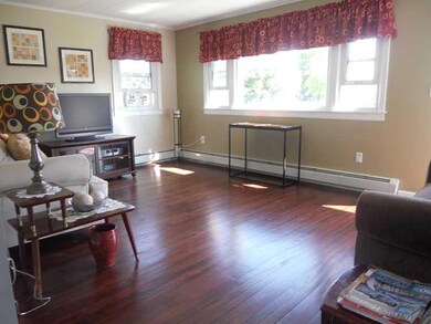 Living Room. Sunlit living room with...