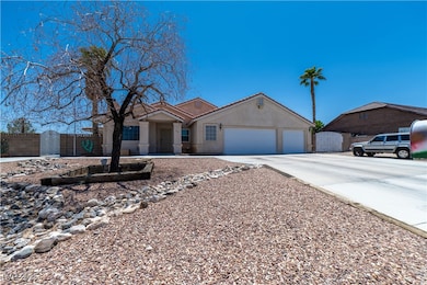Single story home with concrete driveway, an attac