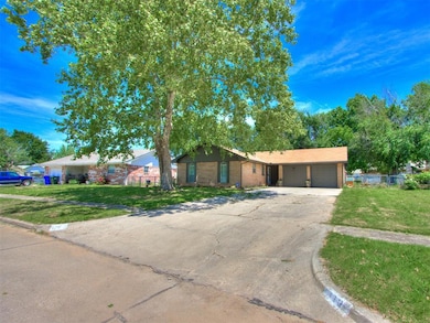 Single story home with a garage and driveway
