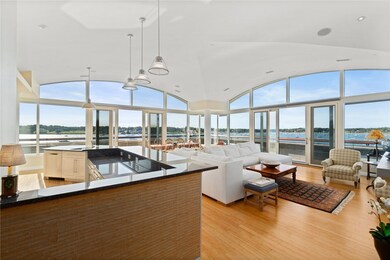 Vaulted ceilings frame the wall of windows overloo