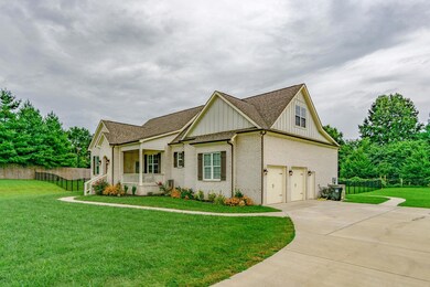 Two car garage adds to the functionality of the home that has everything.