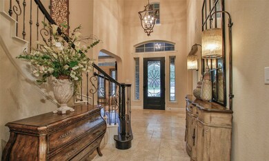 Enter in this gorgeous home on travertine floors and high ceilings