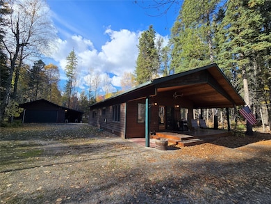 View of side of property featuring an outbuilding and a garage