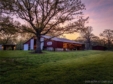 Open side stalls overlook a stocked, 1 acre lot, h