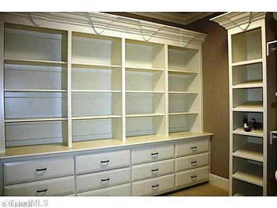 Master Bedroom. Master Closet with Built-in Custom cabinets and shelving