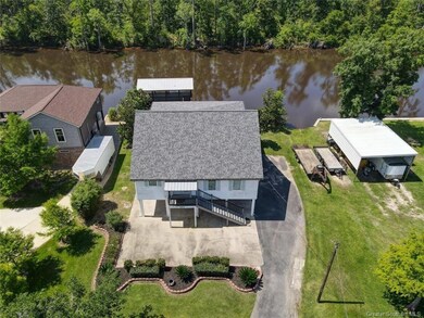 Aerial view of home with Calcasieu River in backgr