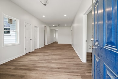 Foyer entrance featuring wood finished floors and