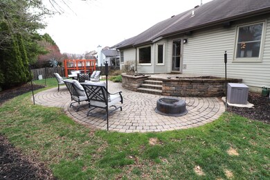 Custom paver patio with raised beds