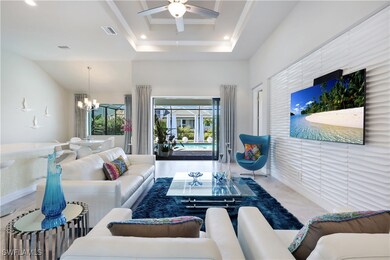 Tiled living room with ceiling fan with notable ch