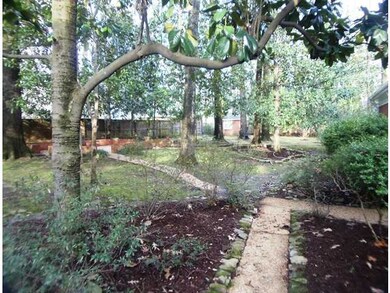 The entire 1.06 acre lot is beautifully landscaped