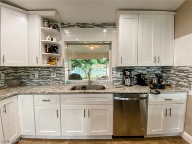 Touch free faucet overlooks the large backyard.  This is also a serving window to the oversized lanai.