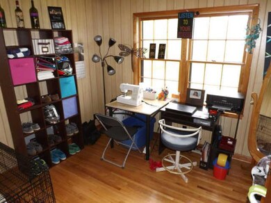 Bedroom 2 is currently being used as an office and also boasts hardwood floors, large windows and closet.