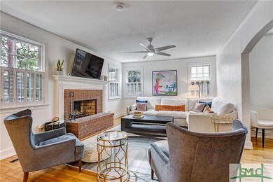 Bright, spacious living room w/fireplace.