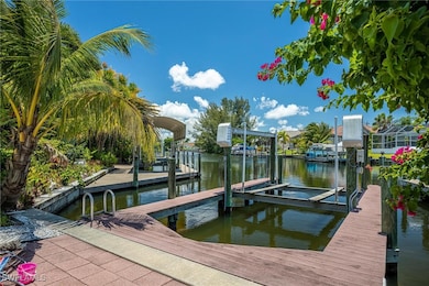 Dock area with boat lift and a water view