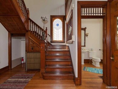 Outstanding woodwork in front hall and on spindled